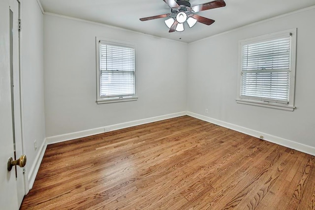 unfurnished room with ceiling fan, crown molding, and light wood-type flooring