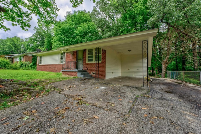 ranch-style house with a carport