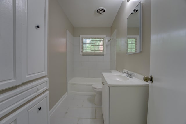 full bathroom with tiled shower / bath, oversized vanity, toilet, and tile floors