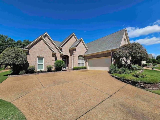 view of front facade featuring a garage and a front lawn