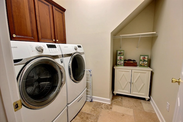 laundry area featuring cabinets and independent washer and dryer