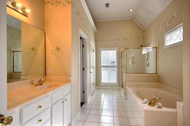 bathroom with vanity, vaulted ceiling, independent shower and bath, and a healthy amount of sunlight