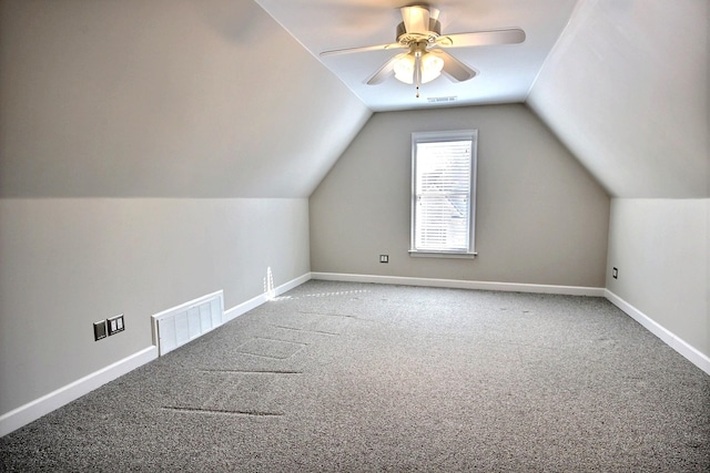 additional living space featuring carpet floors, lofted ceiling, and ceiling fan