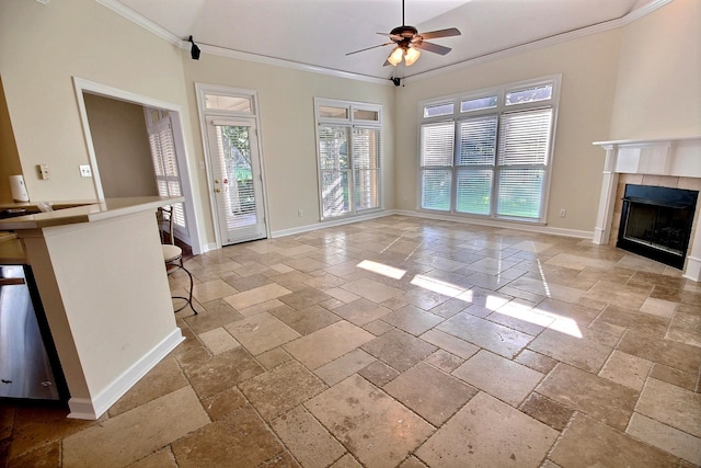 unfurnished living room with crown molding, a fireplace, and ceiling fan