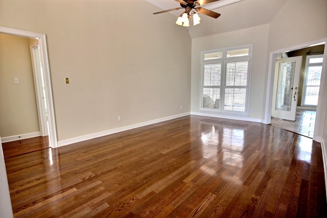 spare room with vaulted ceiling, dark hardwood / wood-style flooring, and ceiling fan