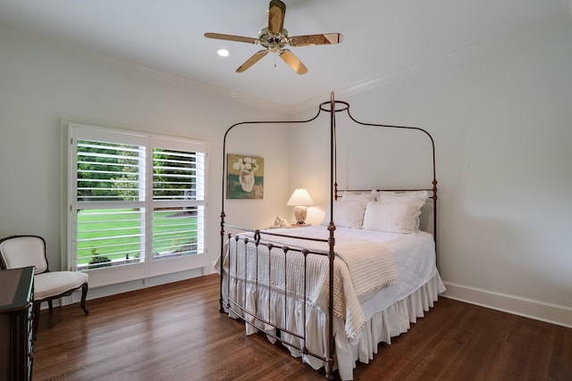 bedroom with ornamental molding, dark hardwood / wood-style floors, and ceiling fan