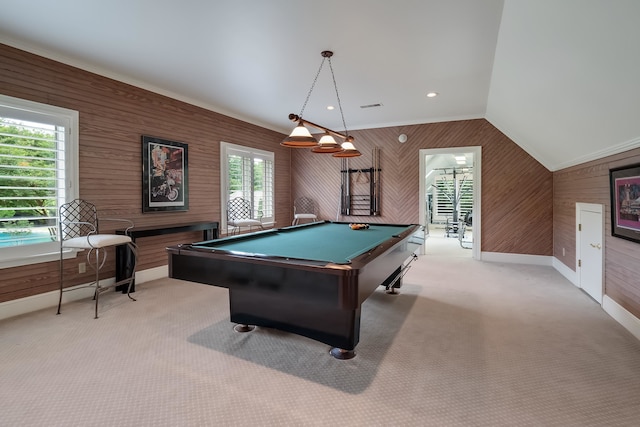 rec room with vaulted ceiling, light carpet, wooden walls, and billiards