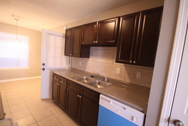 kitchen with white dishwasher, sink, tasteful backsplash, and dark brown cabinetry