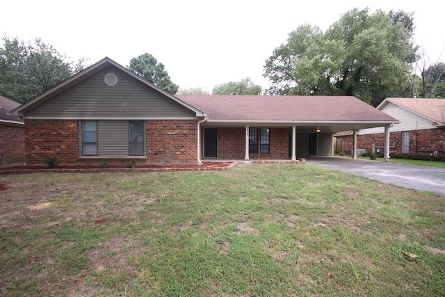 ranch-style house featuring a carport and a front yard