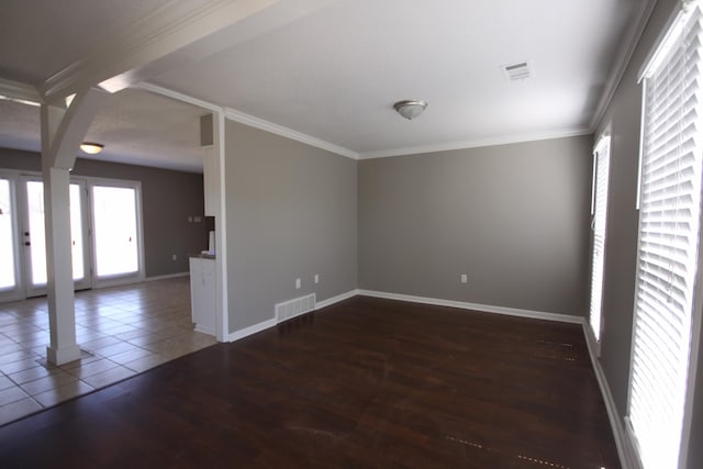 unfurnished room with hardwood / wood-style flooring and ornamental molding