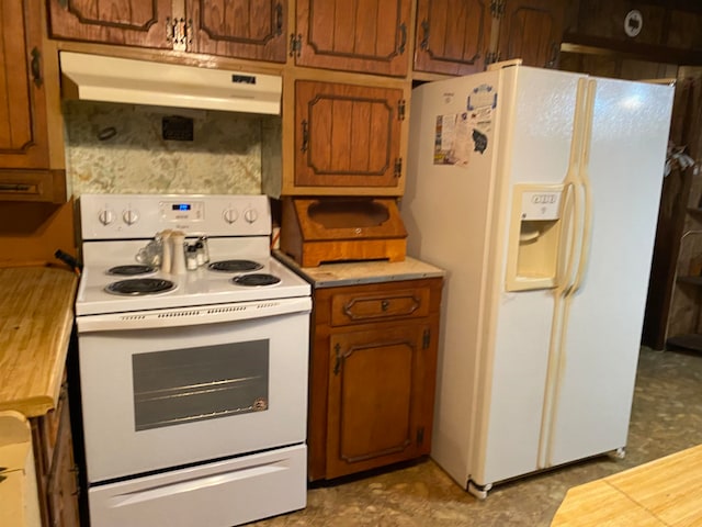 kitchen with tile flooring and white appliances