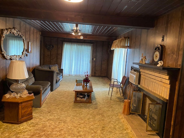 living room featuring beamed ceiling, wooden walls, carpet floors, and wood ceiling