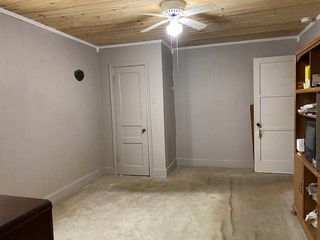 unfurnished office featuring light colored carpet, ornamental molding, ceiling fan, and wood ceiling