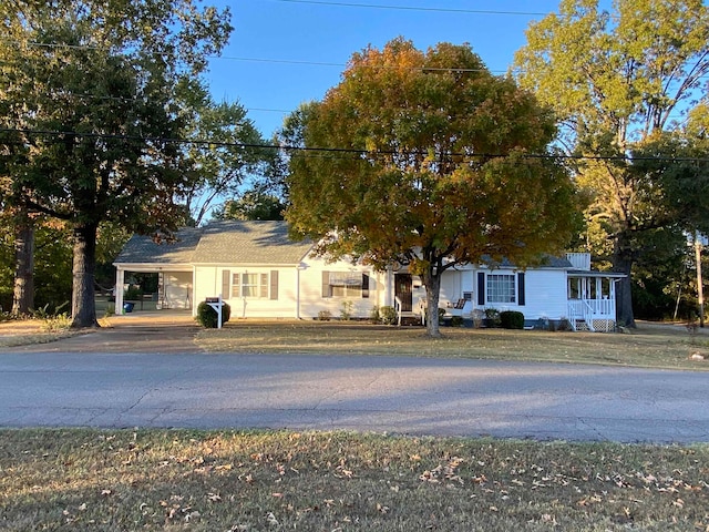 view of front of home with a carport