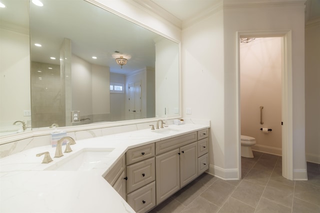 bathroom featuring tile flooring, ornamental molding, large vanity, toilet, and dual sinks