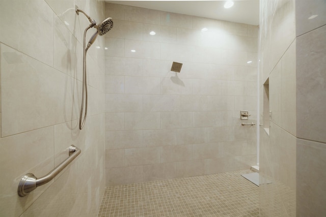 bathroom with a tile shower