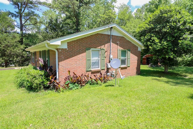 view of home's exterior with a yard