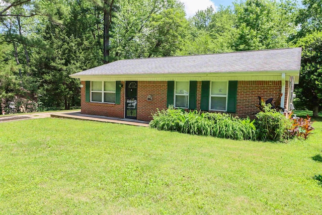 ranch-style home with a front lawn