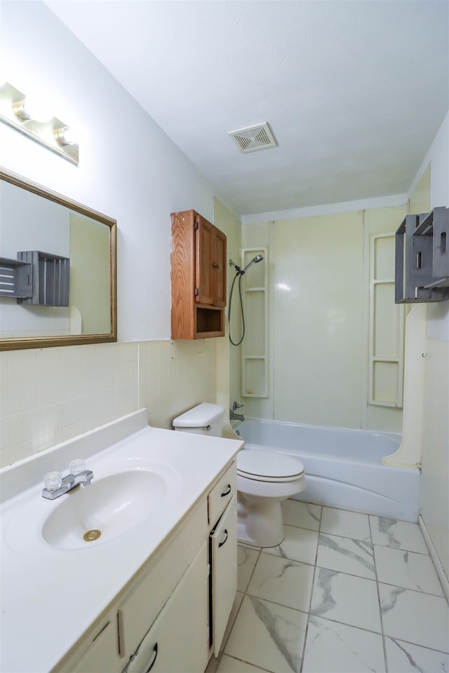 full bathroom with tile floors, washtub / shower combination, backsplash, and toilet