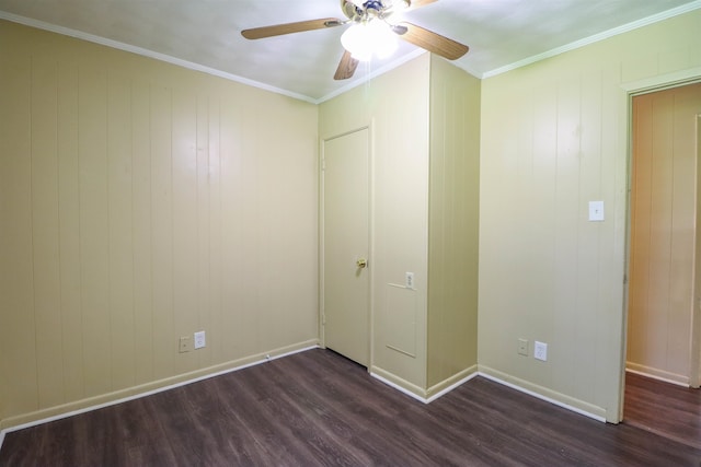 unfurnished bedroom featuring ceiling fan, dark hardwood / wood-style flooring, and ornamental molding