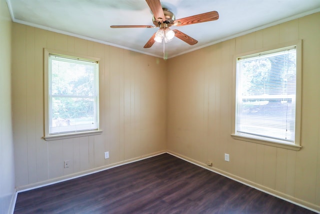 unfurnished room with crown molding, dark hardwood / wood-style floors, and ceiling fan