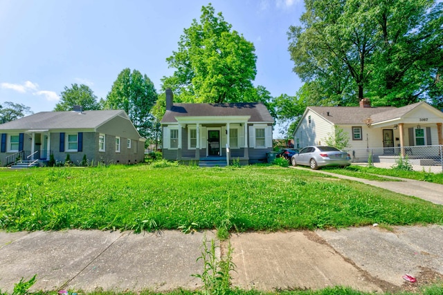 bungalow-style house featuring a front yard and a porch