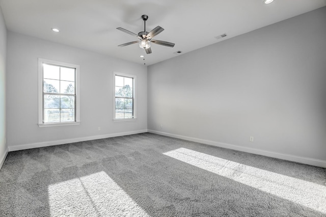 carpeted empty room featuring ceiling fan