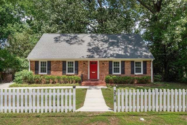 view of front of property with a front lawn