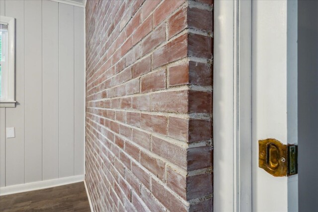 interior details featuring hardwood / wood-style flooring