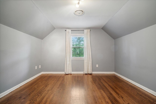 bonus room featuring vaulted ceiling and hardwood / wood-style floors