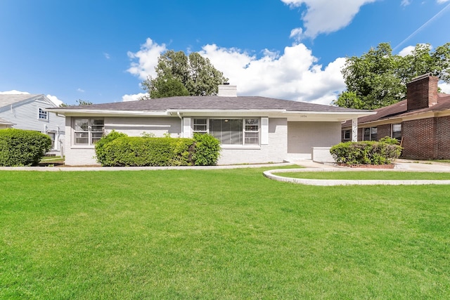 single story home with a front yard