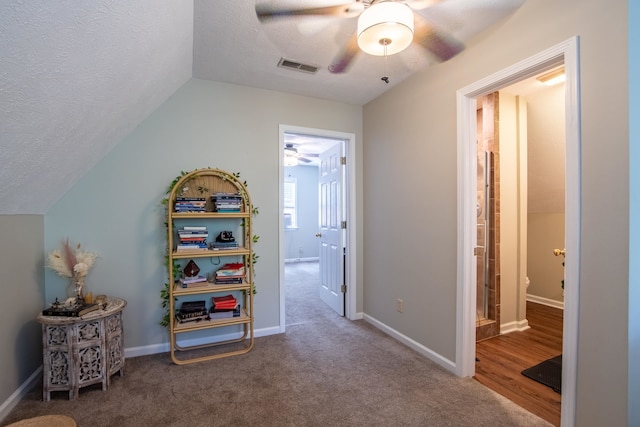 playroom with carpet flooring, ceiling fan, a textured ceiling, and lofted ceiling