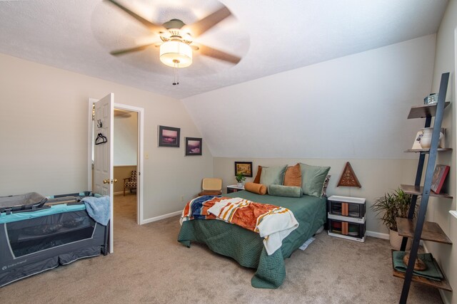 bedroom featuring vaulted ceiling, carpet, and ceiling fan