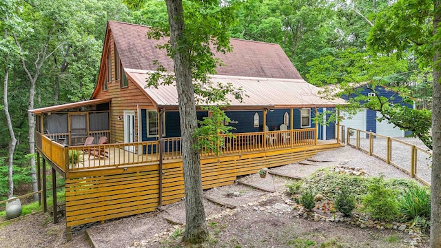 view of front of property with a wooden deck