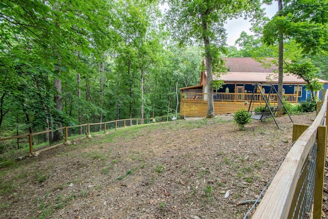 view of yard featuring a wooden deck