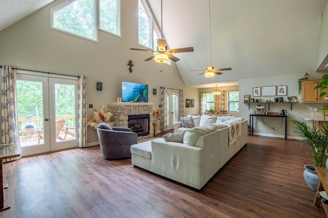 living room with high vaulted ceiling, dark hardwood / wood-style flooring, and plenty of natural light