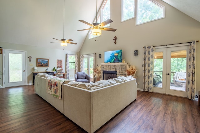 living room with high vaulted ceiling, dark wood-type flooring, a healthy amount of sunlight, and ceiling fan