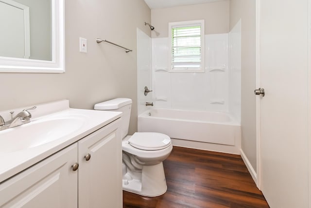 full bathroom with bathtub / shower combination, hardwood / wood-style floors, vanity, and toilet