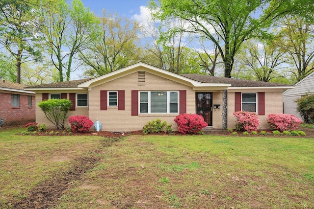 ranch-style house featuring a front lawn