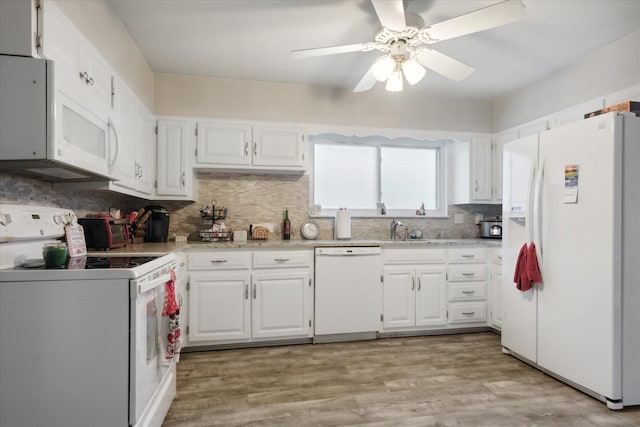 kitchen with backsplash, white cabinetry, ceiling fan, and white appliances