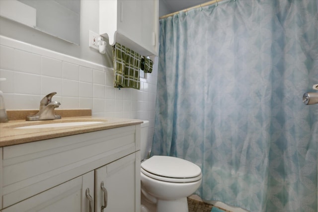 bathroom featuring toilet, decorative backsplash, vanity, tile walls, and a shower with shower curtain