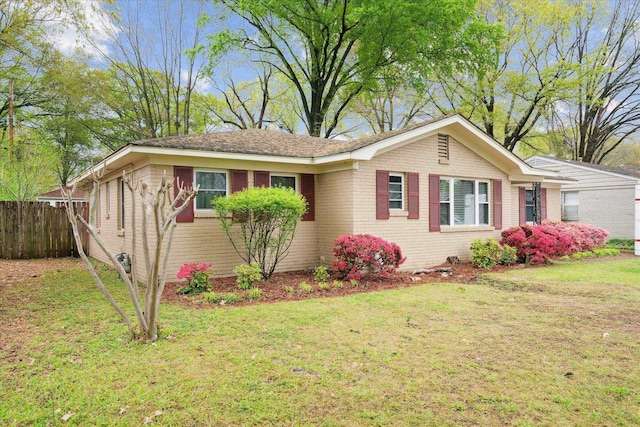 single story home featuring a front yard