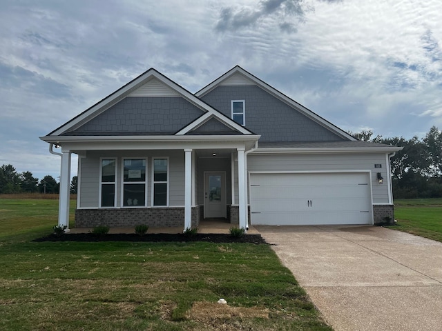 craftsman-style house featuring a garage, a front lawn, and a porch