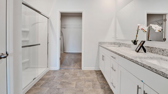 525 Azalea Dr, Somerville, TN 38068 - bathroom with a stall shower, a sink, and a spacious closet