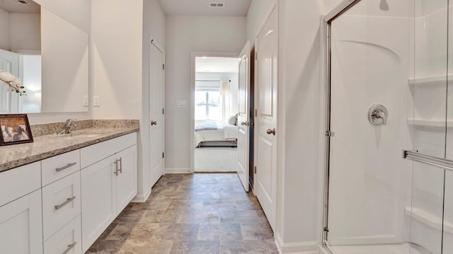 525 Azalea Dr, Somerville, TN 38068 - ensuite bathroom featuring vanity, baseboards, a stall shower, ensuite bathroom, and stone finish flooring