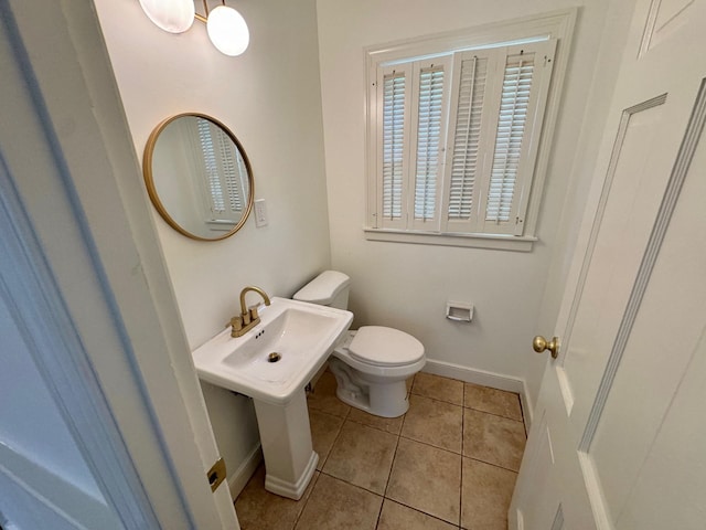 bathroom featuring tile patterned floors and toilet