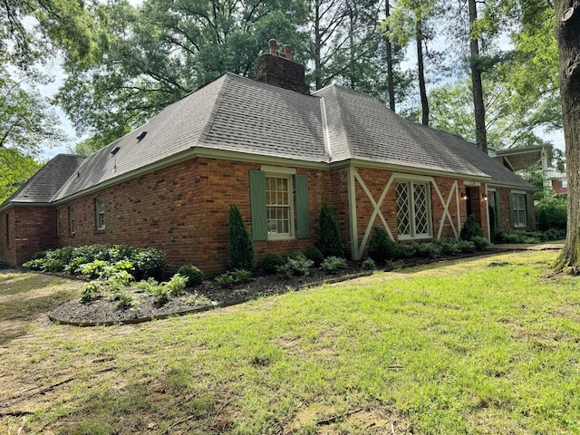 view of property exterior with a lawn