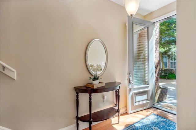 doorway to outside with light wood-type flooring