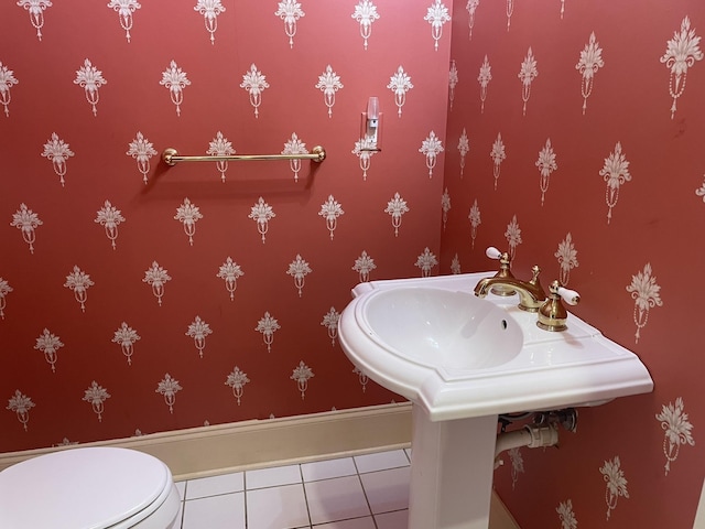 bathroom featuring tile patterned flooring and toilet