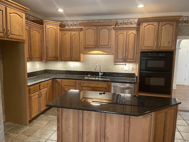 kitchen with dark stone countertops, crown molding, sink, and black appliances